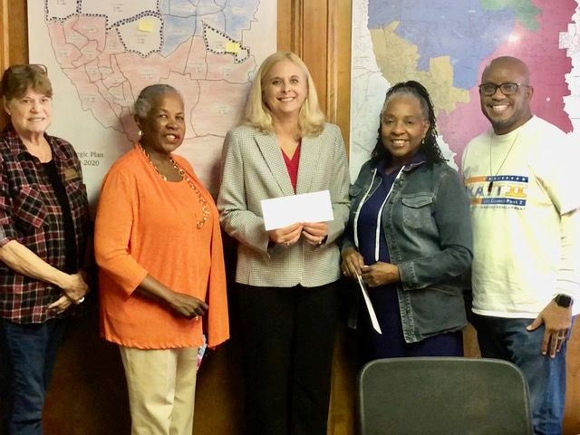 FDW Supports Women Health and Presents a Check to the Fayette Care Clinic